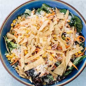 Casero Greens salad with roasted corn, cotija and tortilla strips