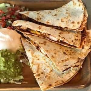 Chipotle chicken quesadilla with guacamole and salsa fresca