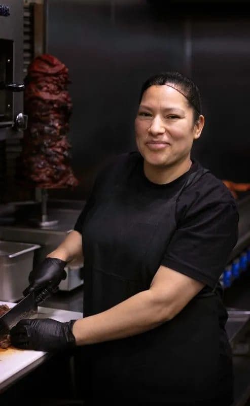 Casero cook smiling in the kitchen