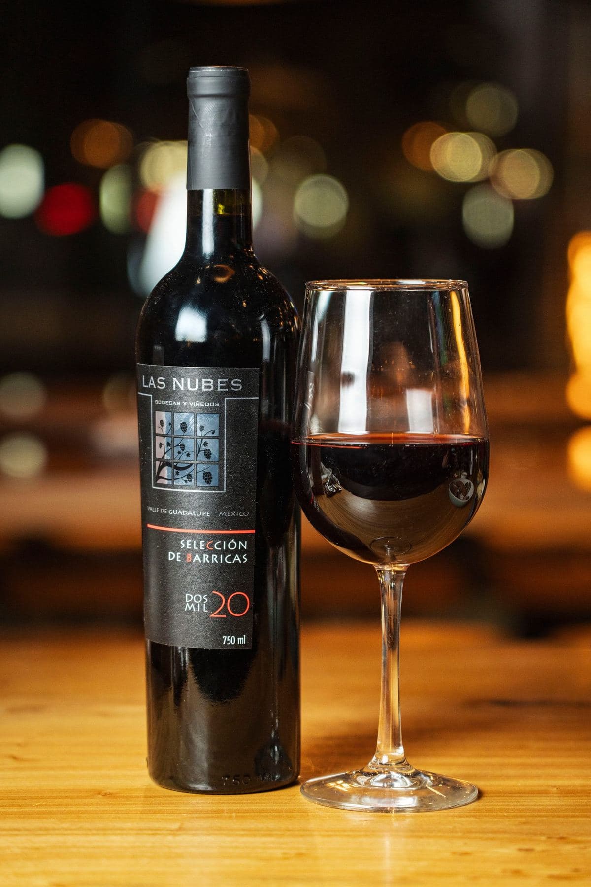 Las Nubes red blend from Valle de Guadalupe with a glass of red wine