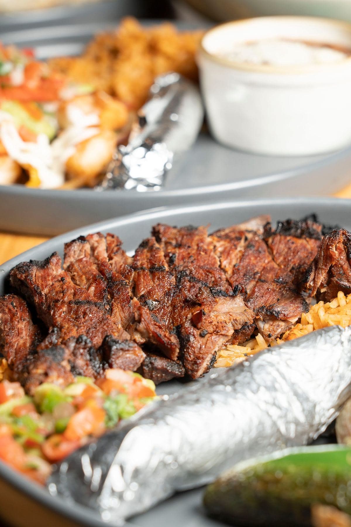 Plato de la Casa with grilled meat, rice, salsa fresca and warm tortillas
