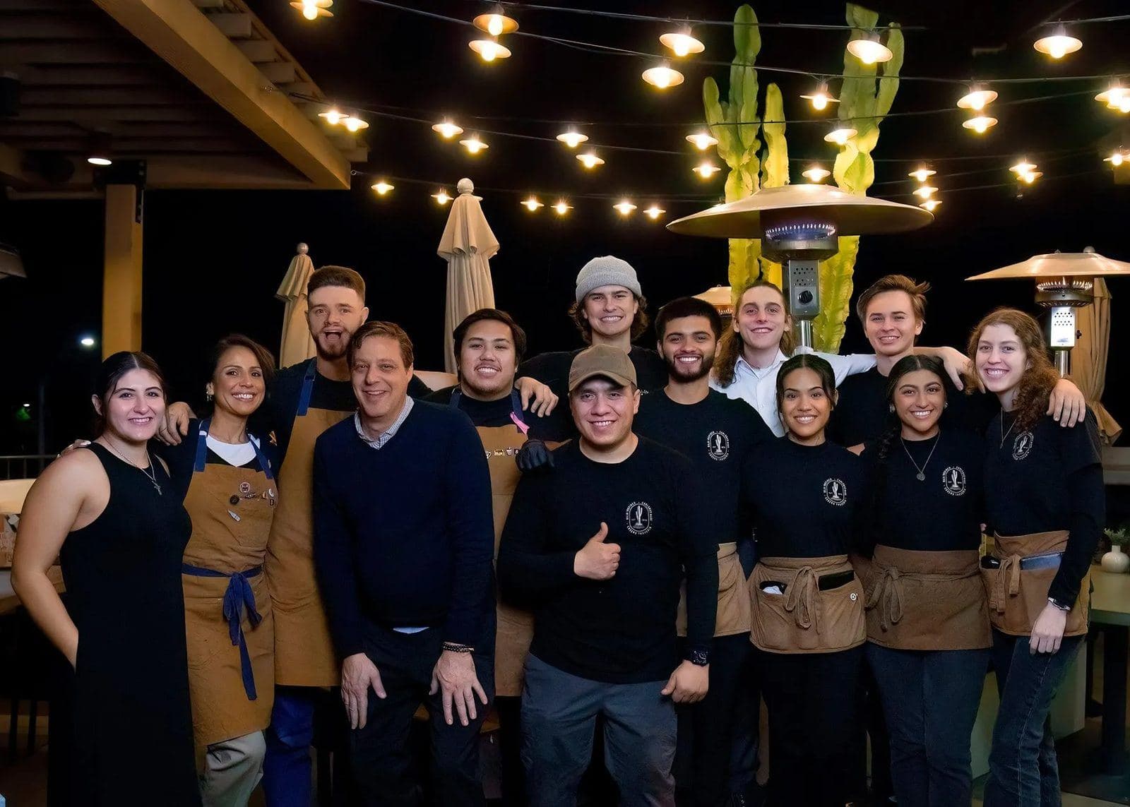 The Casero Taqueria team on the patio at night